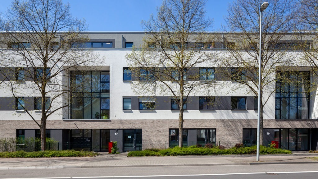 SKANDELLA-residential-office-complex-leverkusen-high-end-plaster-stone-main-street-elevation