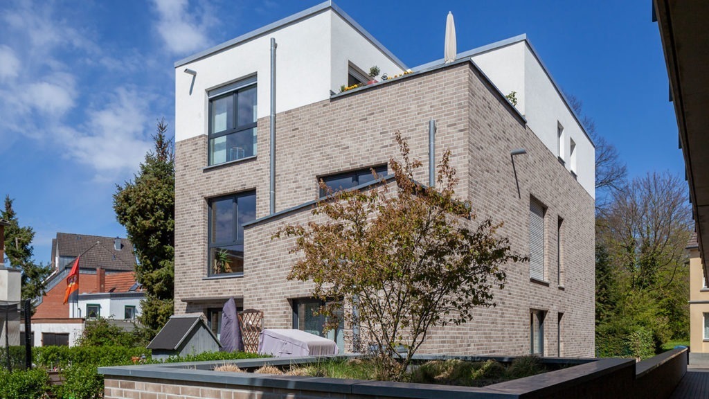 SKANDELLA-residential-office-complex-leverkusen-high-end-plaster-stone-side-view