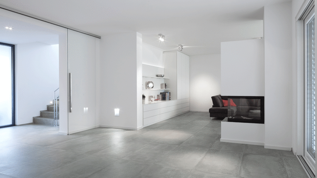 SKANDELLA-villa-roesrath-I-luxury-clear-lines-interior-grey-living-room-fire-place-open-plan-light-diffusion